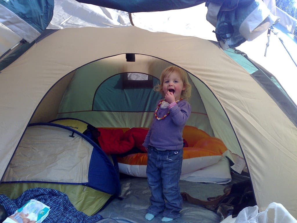 A sleeping bag laid out inside a tent